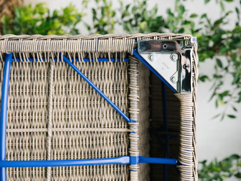 A detail shot of the underside of Outer's All-Weather Wicker outdoor furniture and its aluminum-magnesium alloy frame